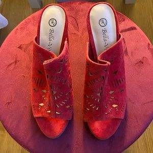 Red suede mules by Bella Vita.